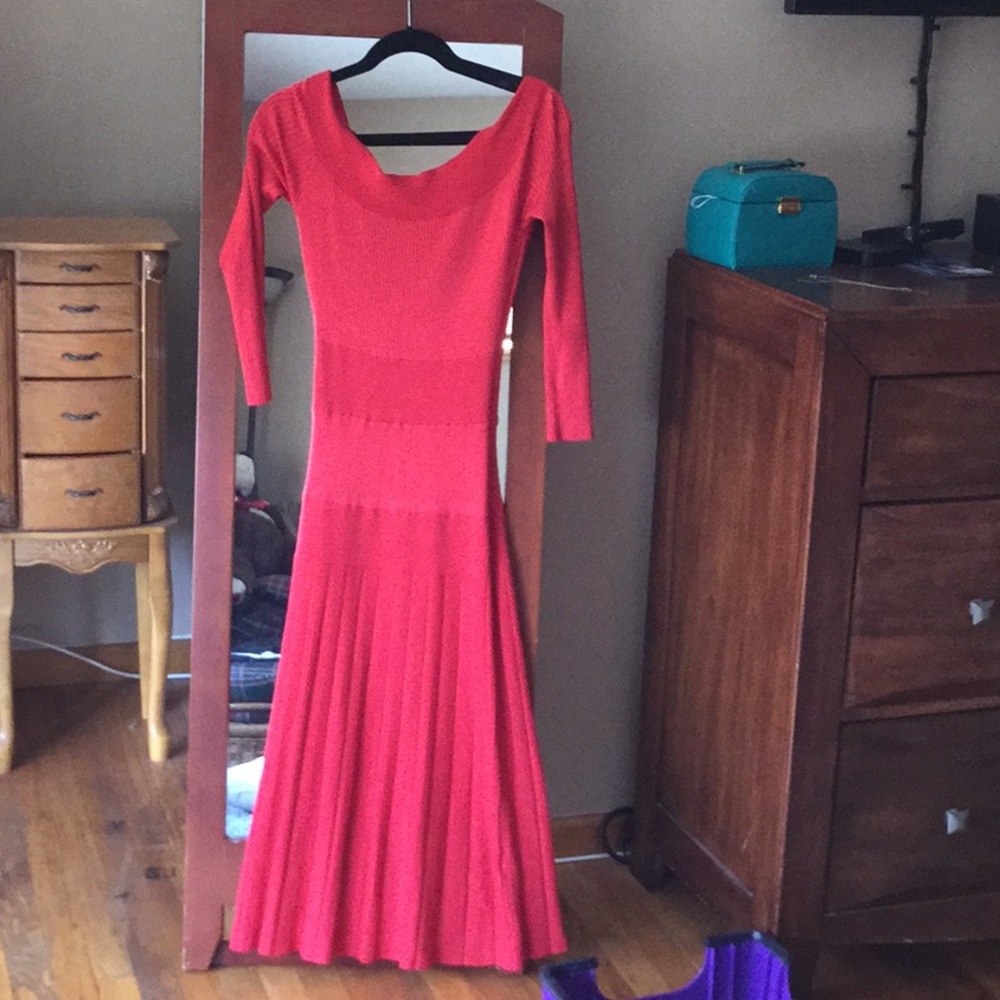 Long red dress with scoop neck.